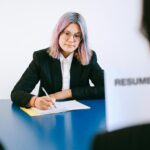 Job candidate confidently attending job interview and answering questions professionally