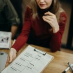 Job seeker carefully reviewing resume and online job application before submission