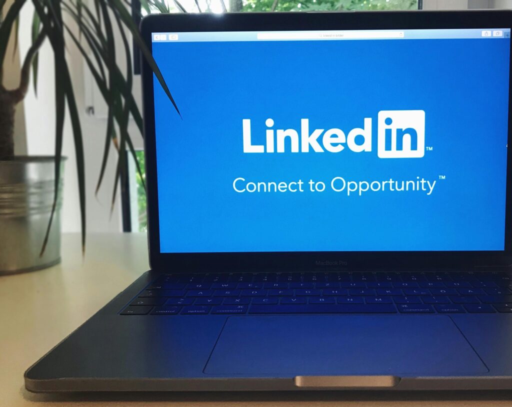 Professional LinkedIn profile optimization on laptop for better job opportunities and recruiter visibility