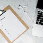 Professional writing simple and effective cover letter for job application on laptop