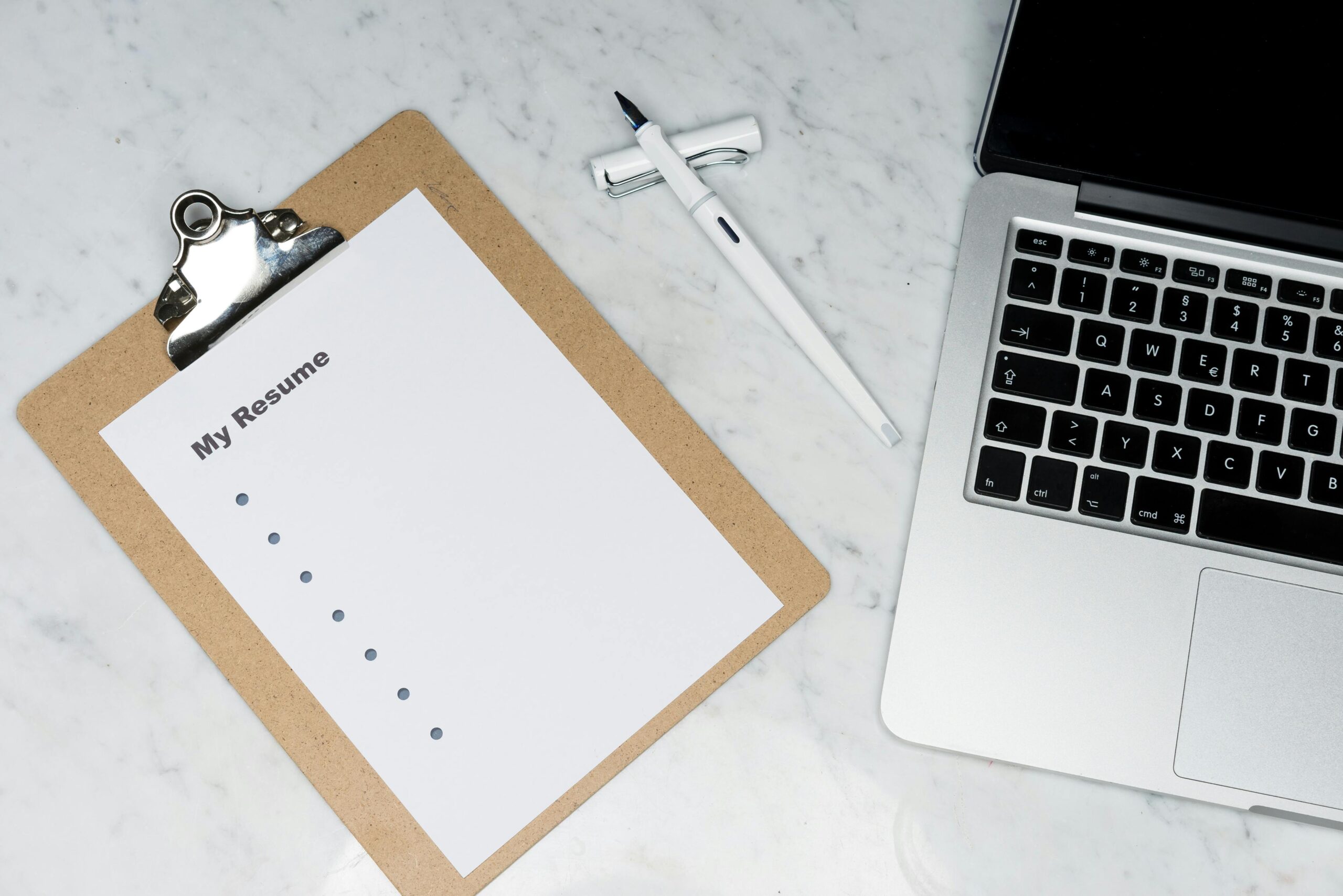 Professional writing simple and effective cover letter for job application on laptop