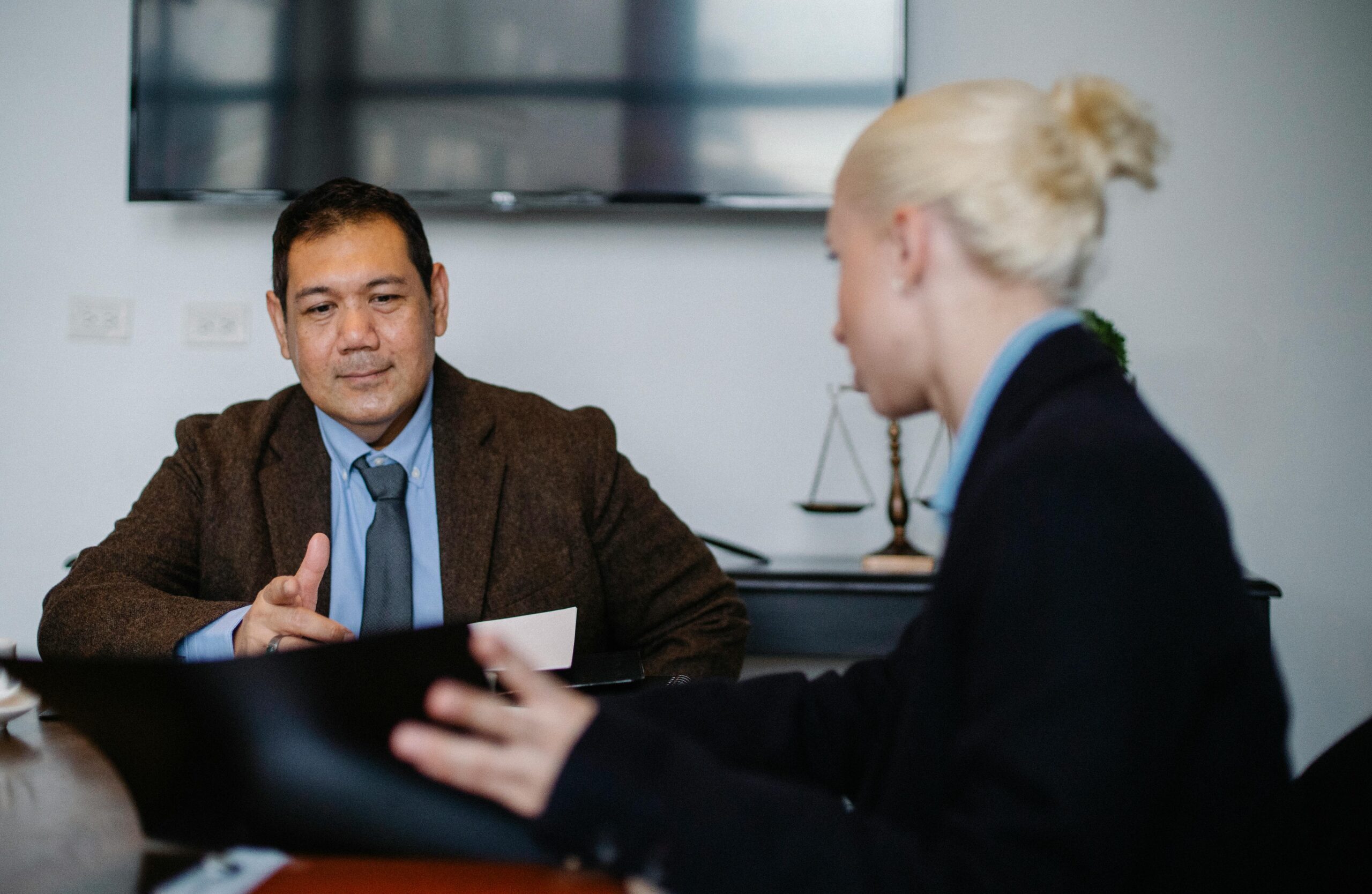 Job candidate demonstrating confident body language during professional interview meeting