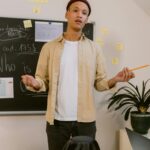 Professional employee confidently presenting ideas during a workplace meeting and demonstrating strong communication skills