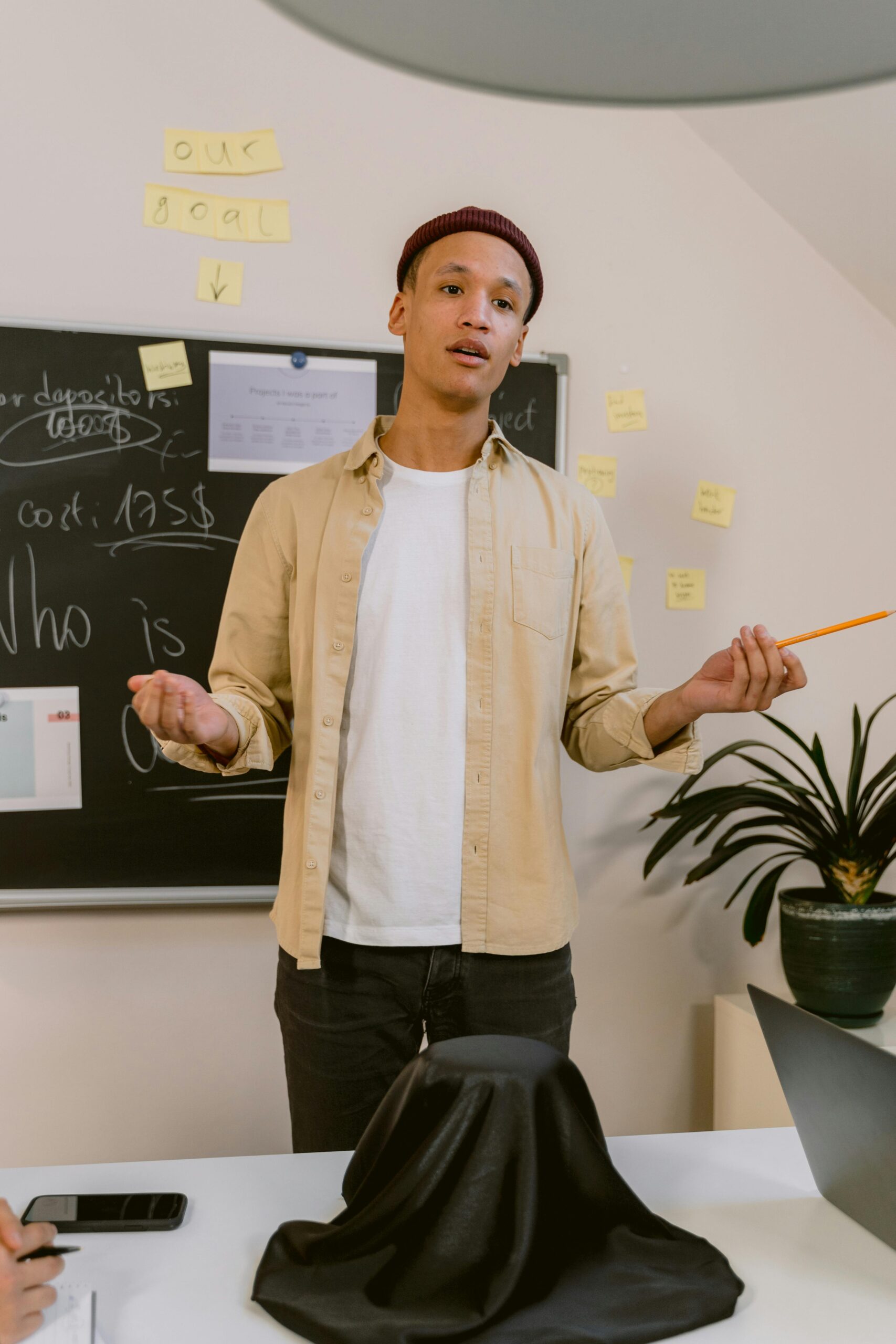 Professional employee confidently presenting ideas during a workplace meeting and demonstrating strong communication skills