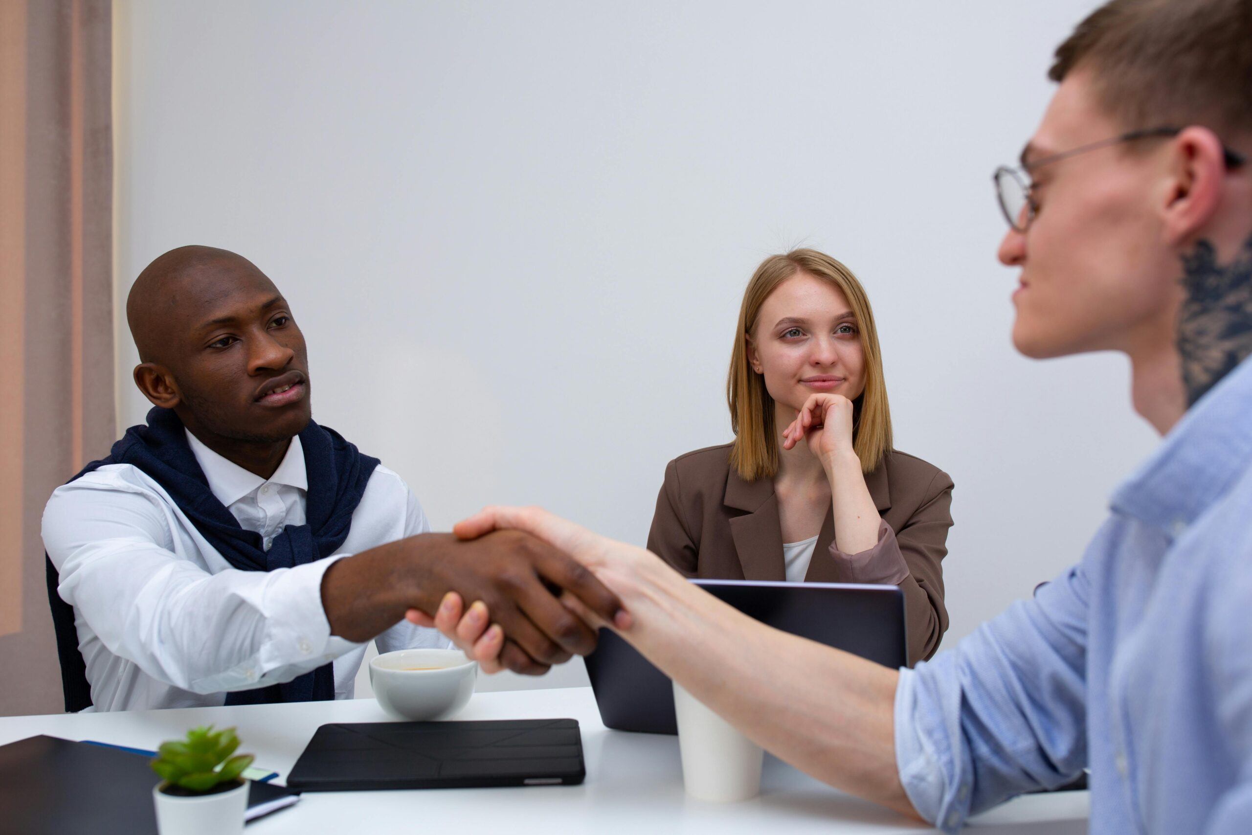 Job candidate answering common HR interview questions confidently during professional interview meeting