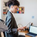 Job seeker staying productive while applying for jobs and improving skills on laptop at home