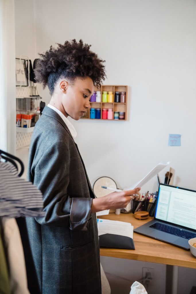 Job seeker staying productive while applying for jobs and improving skills on laptop at home