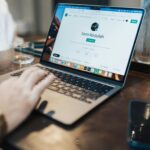 Beginner creating professional LinkedIn profile on laptop for networking and career opportunities
